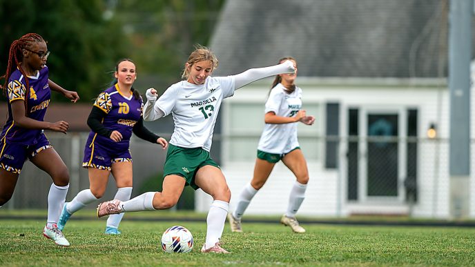 Grace Premo (13) of Mardela High School kicking a soccer ball.