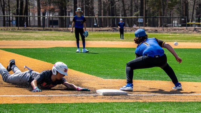 Kids playing baseball at a local park